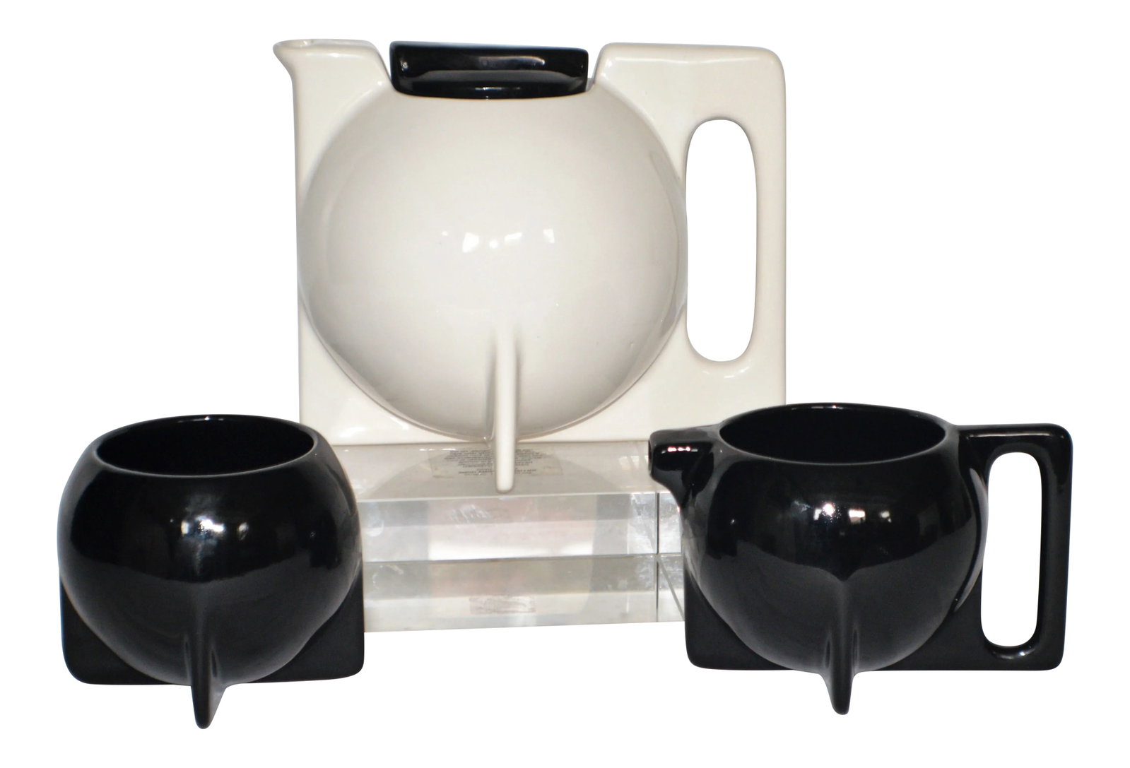 Vintage Bauhaus Memphis-Style Pottery Teapot, Creamer, & Sugar Jar: Manner of Bauhaus Memphis Style coffee and tea service set unsigned and contains no hallmark. White pot w/black lid, black sugar and creamer. The set is used in excellent condition, however, it may