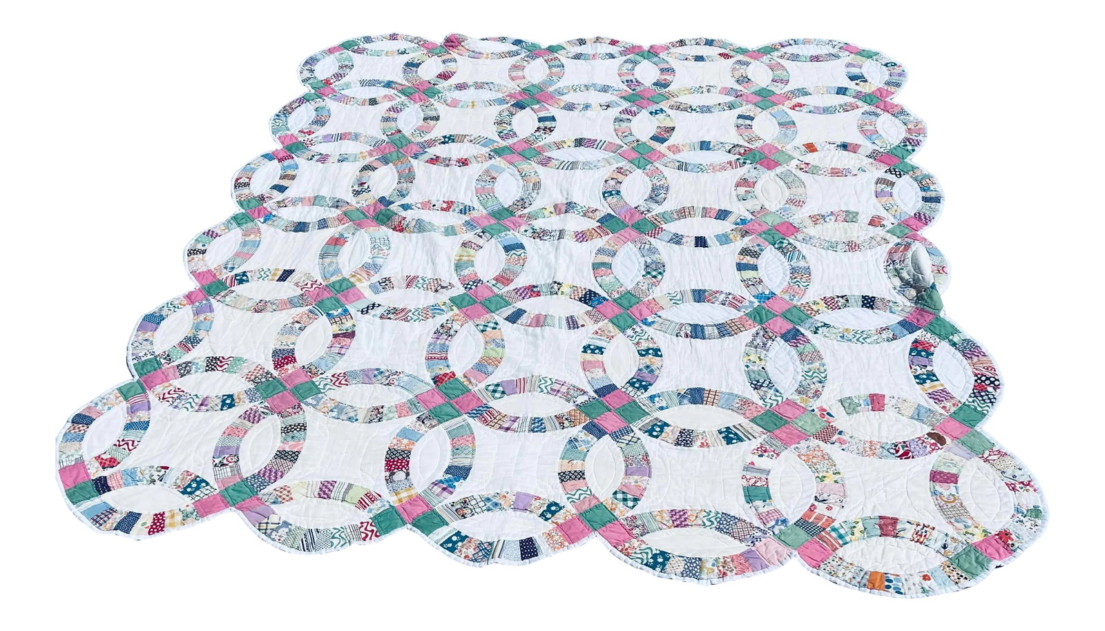 Double Wedding Ring Quilt: Antique American quilt done in the ever popular pattern of the Double Wedding Ring. Circa is 1930's, and the quilt is multi-colored with blue being a dominant color. The quilt measures 83'' x 96'' at 