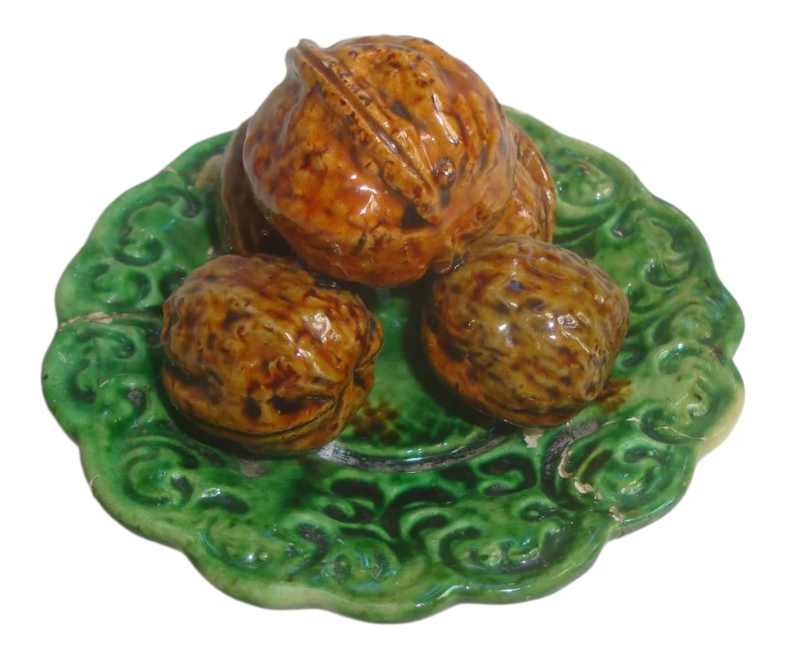 Antique Majolica Trompe l'Oeil Walnut Plate: Wonderful small scale Portuguese antique majolica palissy plate stacked with 5 life-size walnuts. Marked Portugal signed Mafra ( Caldas Da Rainha ). Piece was repaired long ago as can be seen from