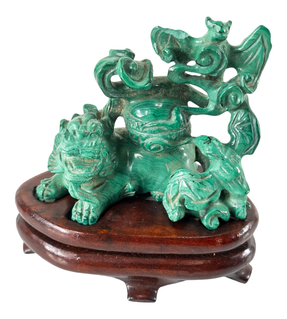 Chinese Carved Malachite Stone Foo Dog With Bats: We are selling this Chinese carved malachite stone group of a Foo dog with bats. The figure was probably carved during the mid to late 20th century, and has a bespoke base. Damage to the wing of the
