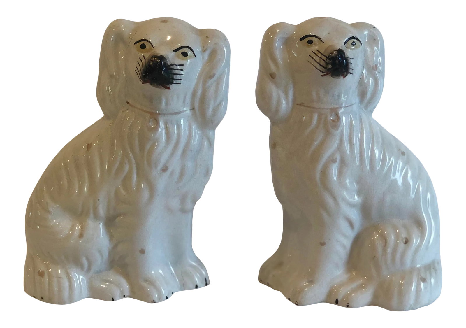 19th Century Victorian Staffordshire Dogs - a Pair: Made in the late 1800s, this pair of Staffordshire dogs are beautiful with just the right amount of patina. Crazing and condition consistent with age. Condition: Alterations: Original Condition