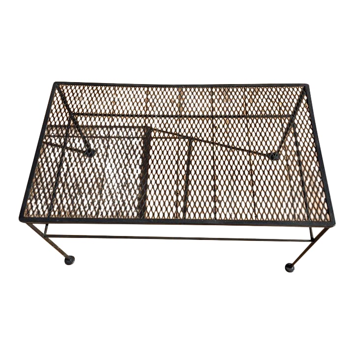 Late 20th Century Wrought Iron Coffee Table: This iron coffee table is simple and traditional in its design, giving it a versatile style. It features welded seams and a sturdy build. Dimensions: 30" x 18" x 15.5" Tall Please review pictures befo