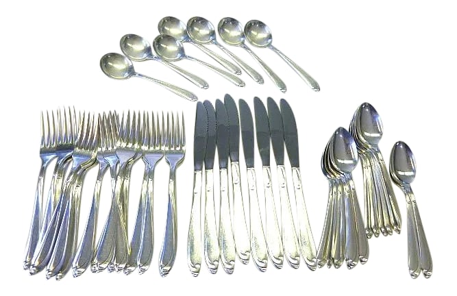 Mid-Century Modern Oneida Skyward Silverplate Flatware Set- 45 Pieces: This is a beautiful 1963 vintage Oneida "Skyward" pattern silverplate flatware set, The pieces are marked "Oneida Ltd". Complete set for 8 missing 1 oval soup spoon This set includes the following: