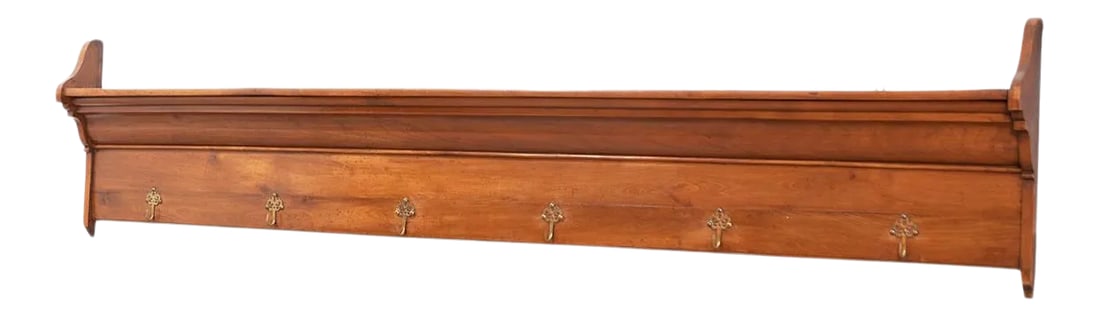 French 19th Century Fruitwood Plate and Coat Rack: A charming French hat or coat rack, with a shelf spanning the top mounted on shaped bracket supports in the profile of crown molding to fit with the architecture of a room. Six hooks are installed
