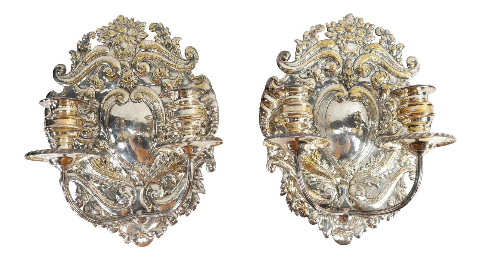 Late 19th Century Dutch or Spanish Silvered Brass Candle Wall Sconces - a Pair: We are offering this nice decorative pair of wall sconces. These sconces in a Dutch or Spanish style are silverplated with repousse work on a base metal with replaced silverplate candleholders. These 