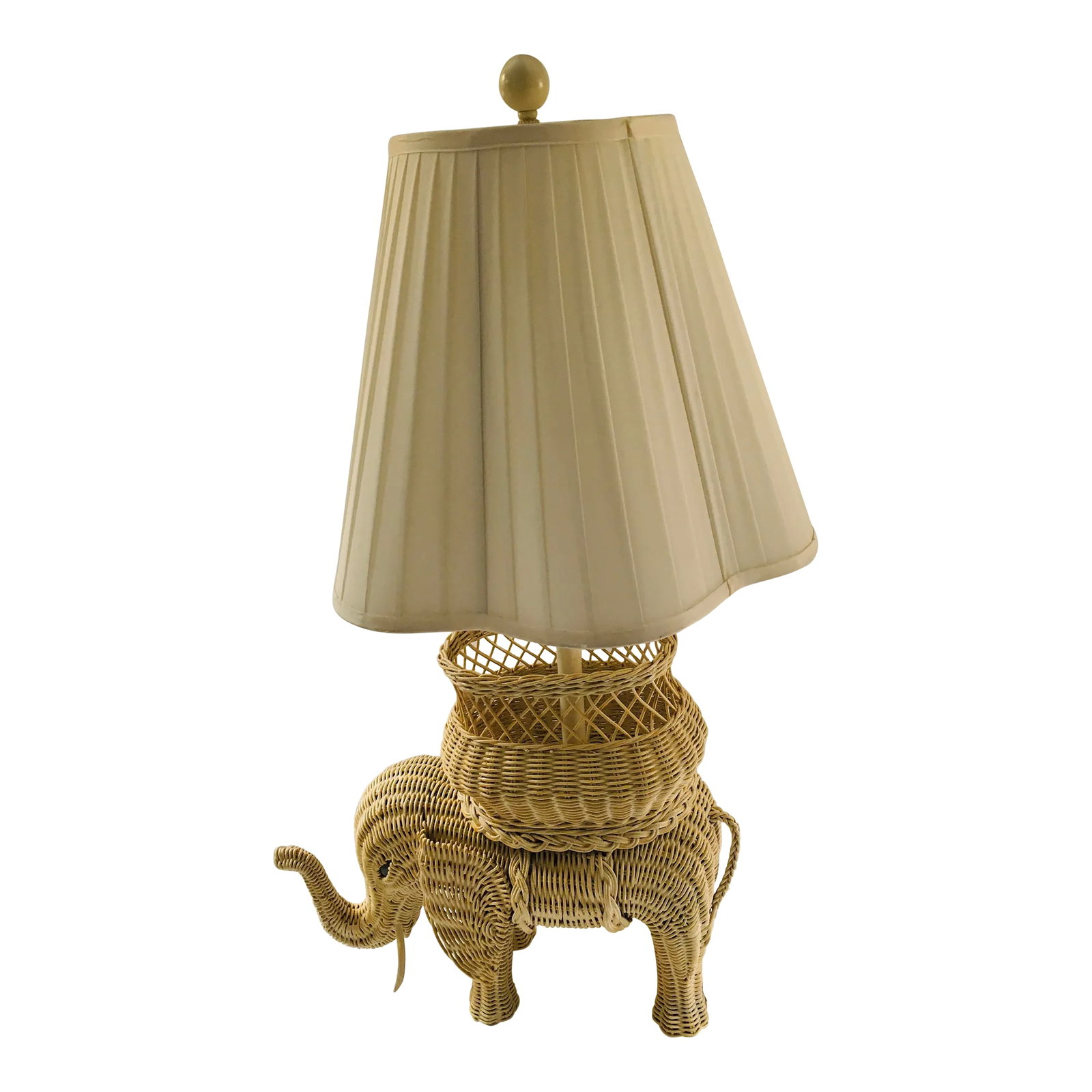 1980s Wicker Elephant Lamp: This charming vintage lamp is made of wicker The elephant with trunk up has glass eyes There is a basket on the elephant's back could have a floral arrangement in it if you wish Very good condition