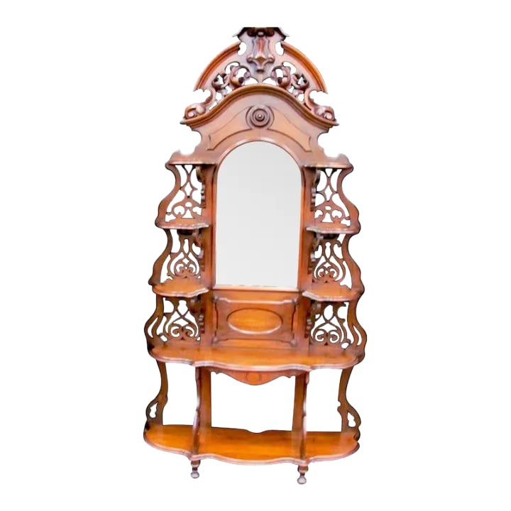 Walnut Victorian Eterge: Hand Carved with original finish and mirror in outstanding condition. 49" W by 16" D by 94" T Condition: Alterations: Unknown Imperfections: Some Imperfections Condition Notes: outstanding condition