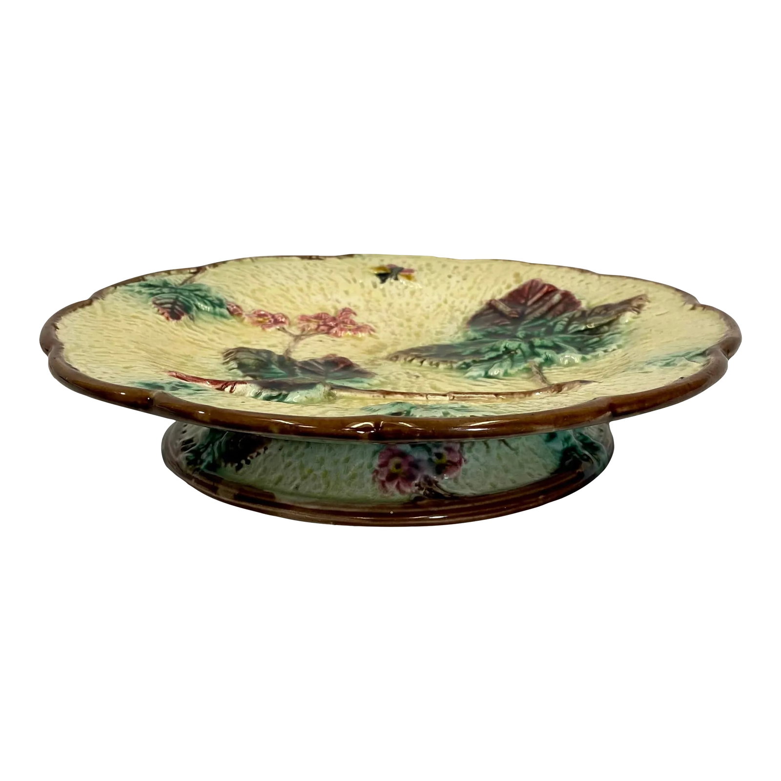 Antique Majolica Cake Stand /Comport Adorned With Leaf & Floral Motif From England - Circa 19th Cent: Antique Majolica Cake Stand /Comport Adorned With Leaf & Floral Motif From England - Circa 19th Century. Measures 9 3/8" W x 9 3/8" D x 1 3/4" T Condition: Alterations: Original Condition Unaltered