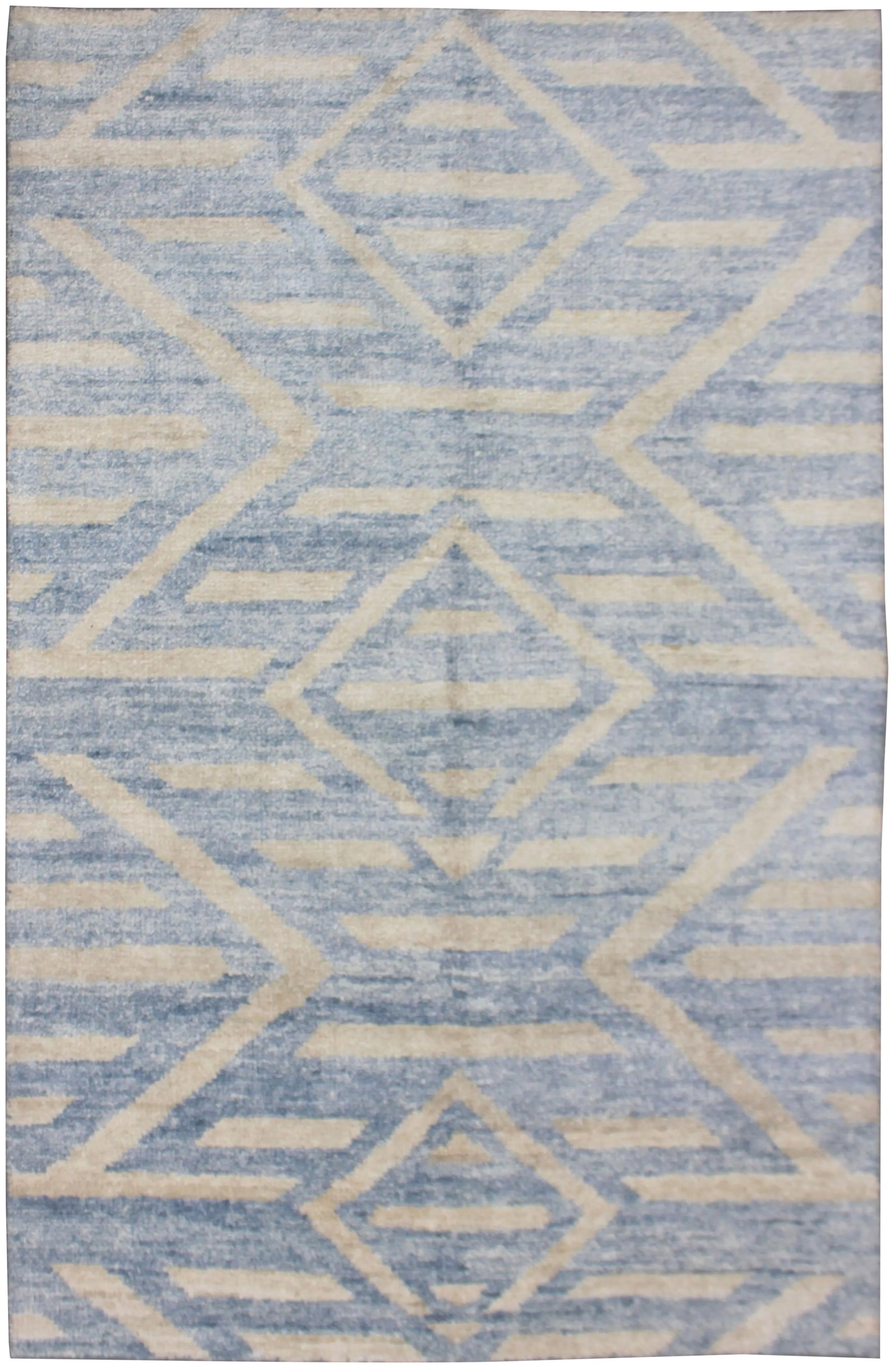 Aara Hand Knotted Bamboo Rug- 5' * 7': A beautiful handmade Bamboo rug. The geometric design woven in by Aara Rug hands. This rug is made of 75% bamboo silk and 25% cotton. This piece will look great in any room, whether it's fitted with a