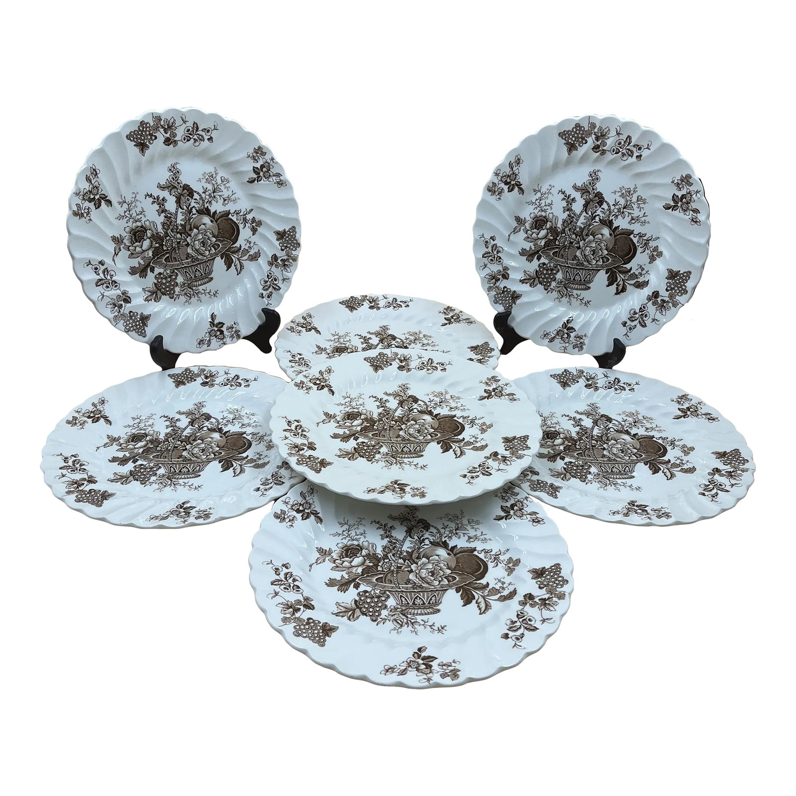 Early 20th Century English Staffordshire Dinner Plates- Set of 7: Classic basket of flowers & fruit design with grapevines bordering the outer swirled & fluted edges. Seven (7) - 10 inch Dinner Plates from the Bountiful Collection of Staffordshire of England, in