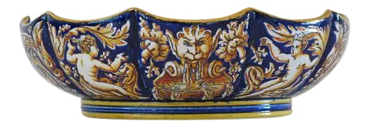 1865 Antique Gien French Renaissance Revival Faience Earthenware Scalloped Bowl: An absolutely stunning c1860 faience renaissance motif bowl by gien. The bowl features a striking motif of scrolling foliage, fountains and putti. Condition on the bowl is fantastic with a nice