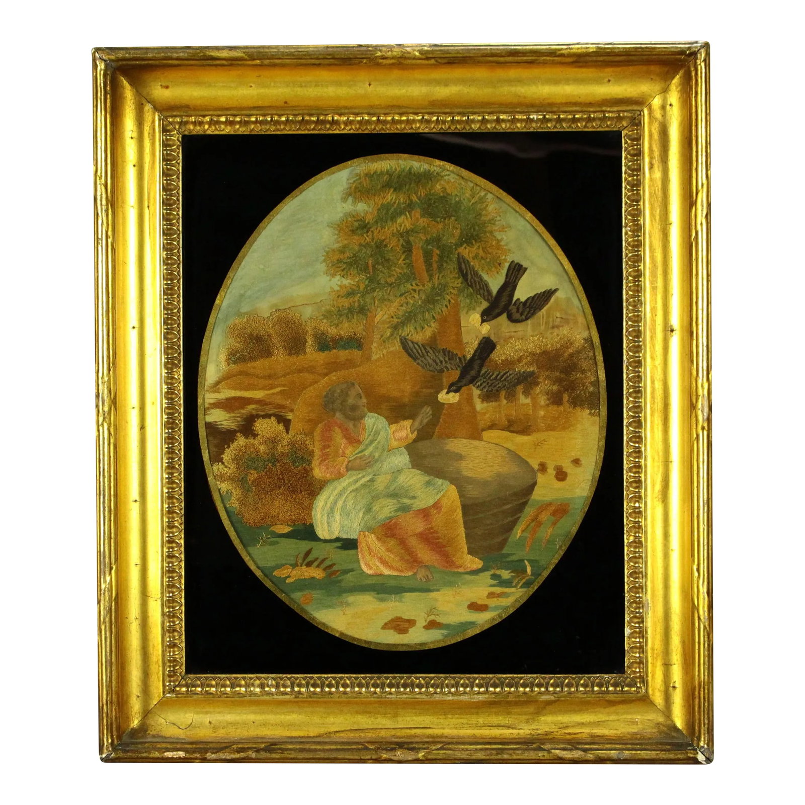 Ea 1800's Silk Embroidery Bible Scene Gilt Eglomise Frame Elijah Fed by Ravens: An outstanding antique silk needlework Skillfully crafted oval embroidery picture, depicting an extensive and well detailed Biblical scene, based on the Book of Kings, chapter 17; portraying the