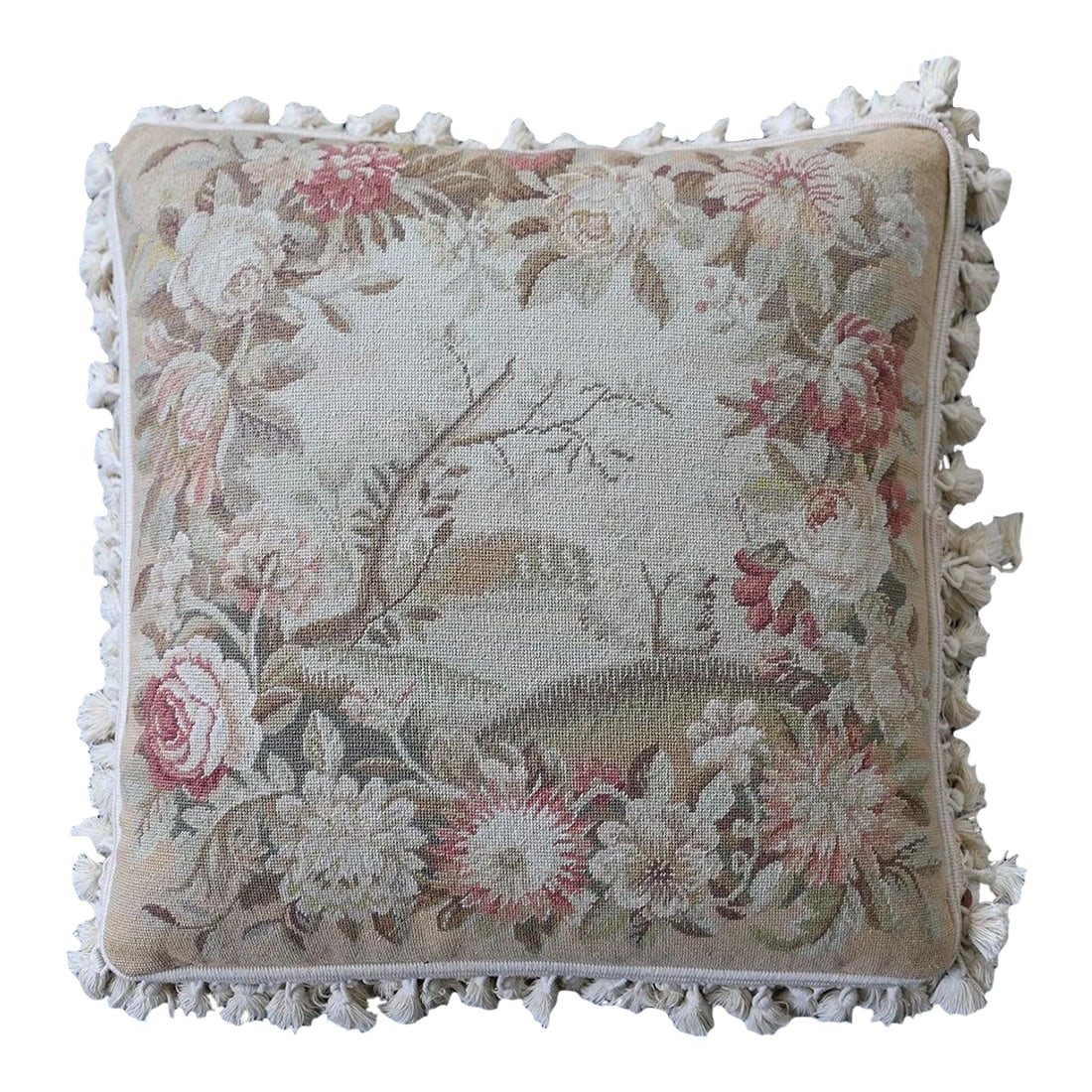 Square Pillow | Cream Floral Needlepoint Deorative Wool Pillow: This cream and tan pillow features intricate floral designs and tasteful tassels along the border, adding a touch of timeless beauty to your decor. Crafted from high-quality wool, it promises both dur