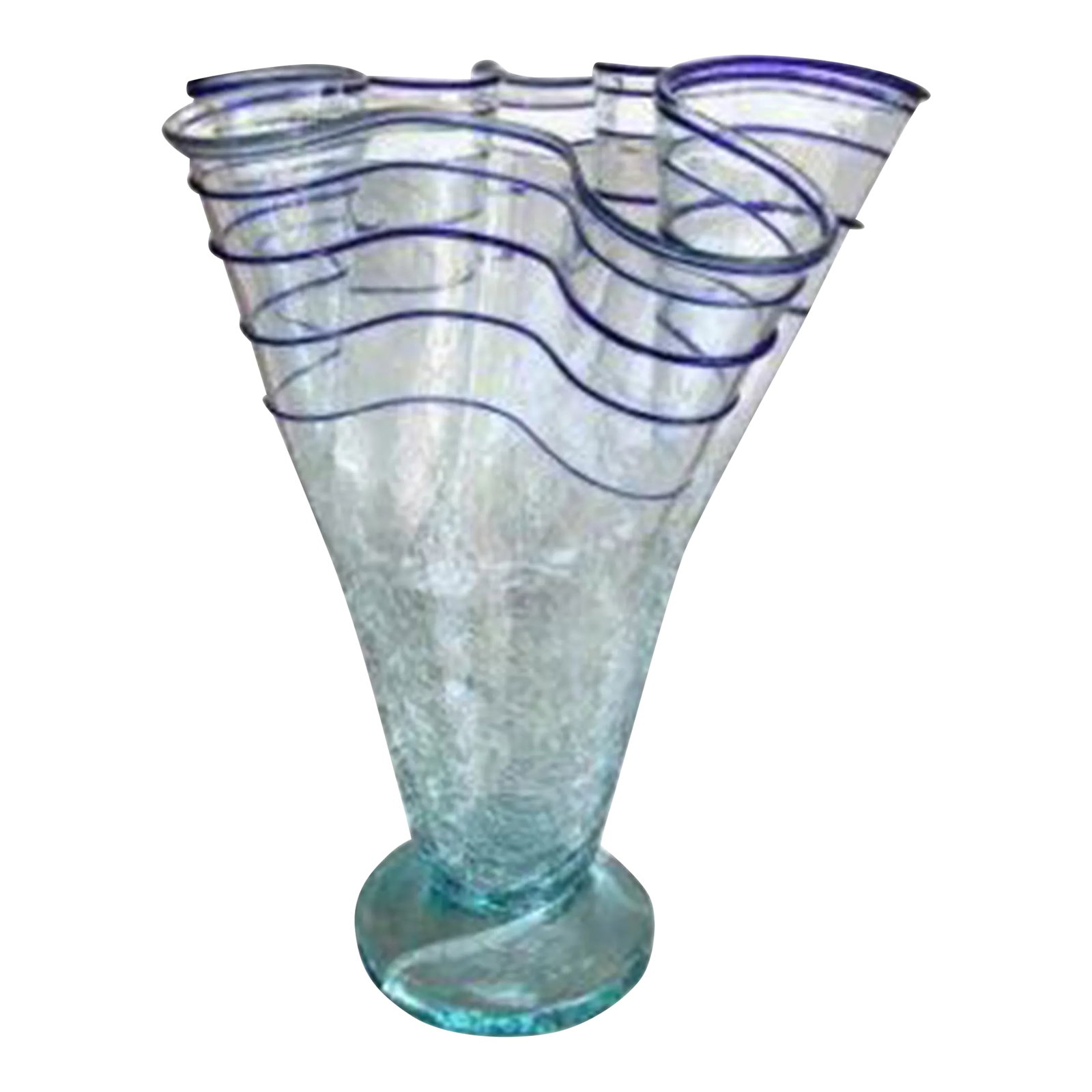 1970s Large Ruffled Crackle Applied Blue Ribbon Art Glass Vase: Magnificent handblown vintage art glass vase. Crafted in the 1970s, this vase boasts a stunning ruffled design with applied blue ribbon accents, and crackling glass. Maintained in good condition, with