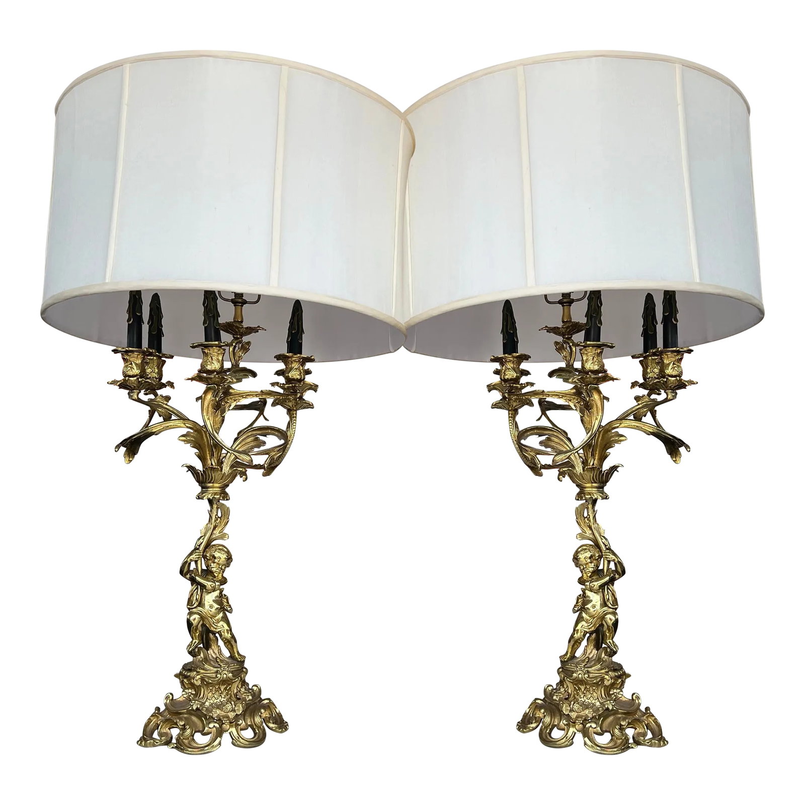 Pair of Mid 20th Century French Gilt Bronze Figural Candelabra: Mid Century Pair of lamps. Gilded gold candelabra figural with shade. A Louis XV Style Gilt Bronze Four Light Candelabrum Table Lamp 19th Century The lamp stands 28 inches tall to socket. 7" x 8 1/2 d