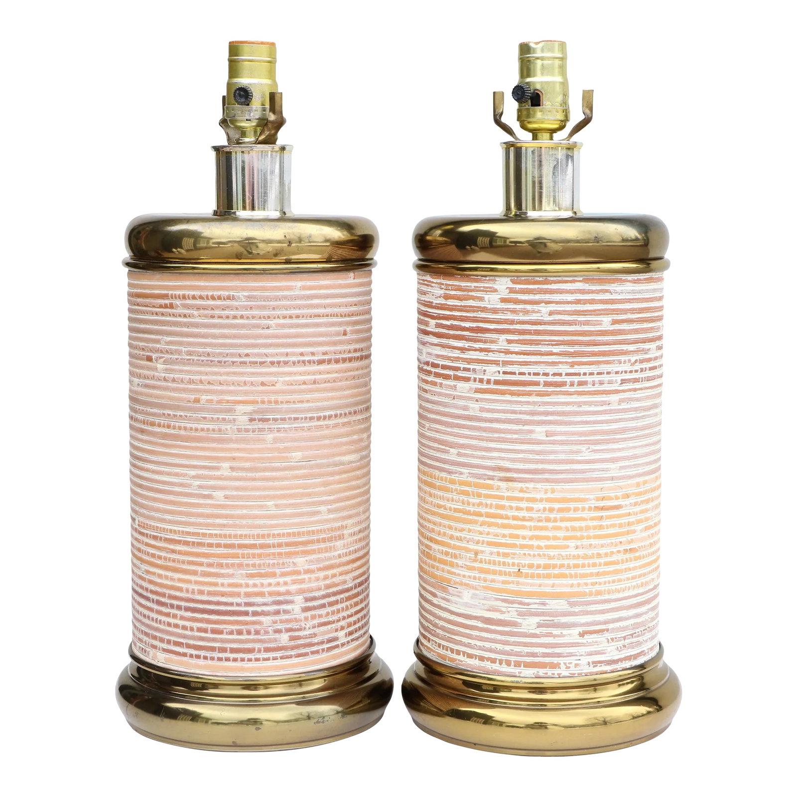 Cerused Reed & Brass Table Lamps - a Pair: Matching pair of vintage coastal table lamps with a compact cylinder form. Chic wrapped split reed construction with a washed finish. They have a multi-hued striped design. They measure 24" tall to