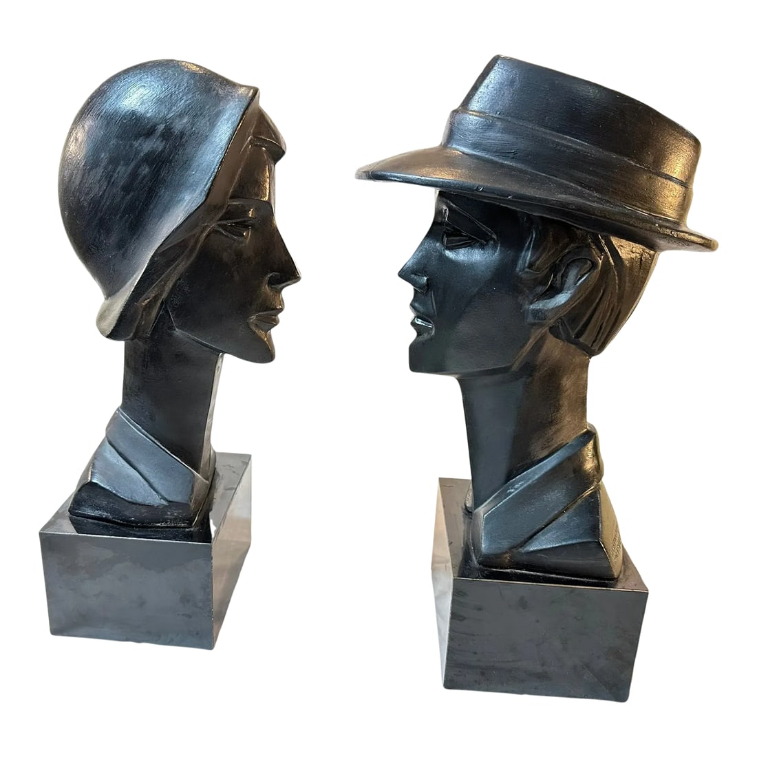Pair 1980s Neo Deco Black Ceramic Man and Woman by David Fisher for Austin Productions: Wonderfully strange black table sculptures by David Fisher for Austin Productions consisting of a man and a woman, both impossibly thin from the front, all deco angles and vintage style. Two distinct