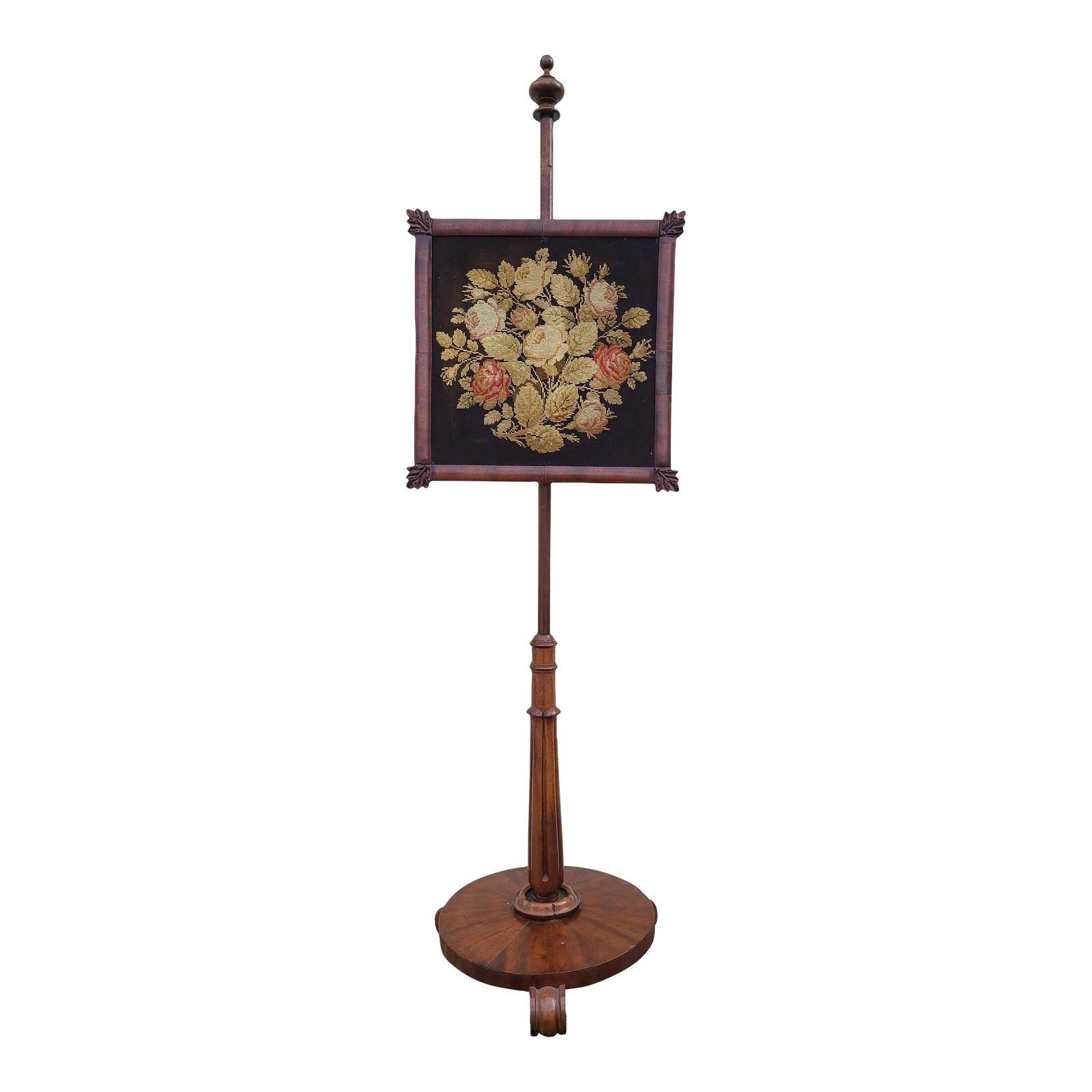 Antique Adjustable Wooden Needlepoint Decorative Fireplace Fire Screen: Pink, yellow, and white roses surrounded by greenery have been lovingly hand cross-stitched on a dark brown background, hung on a wooden frame with ornate and adjustable brass hardware to function as