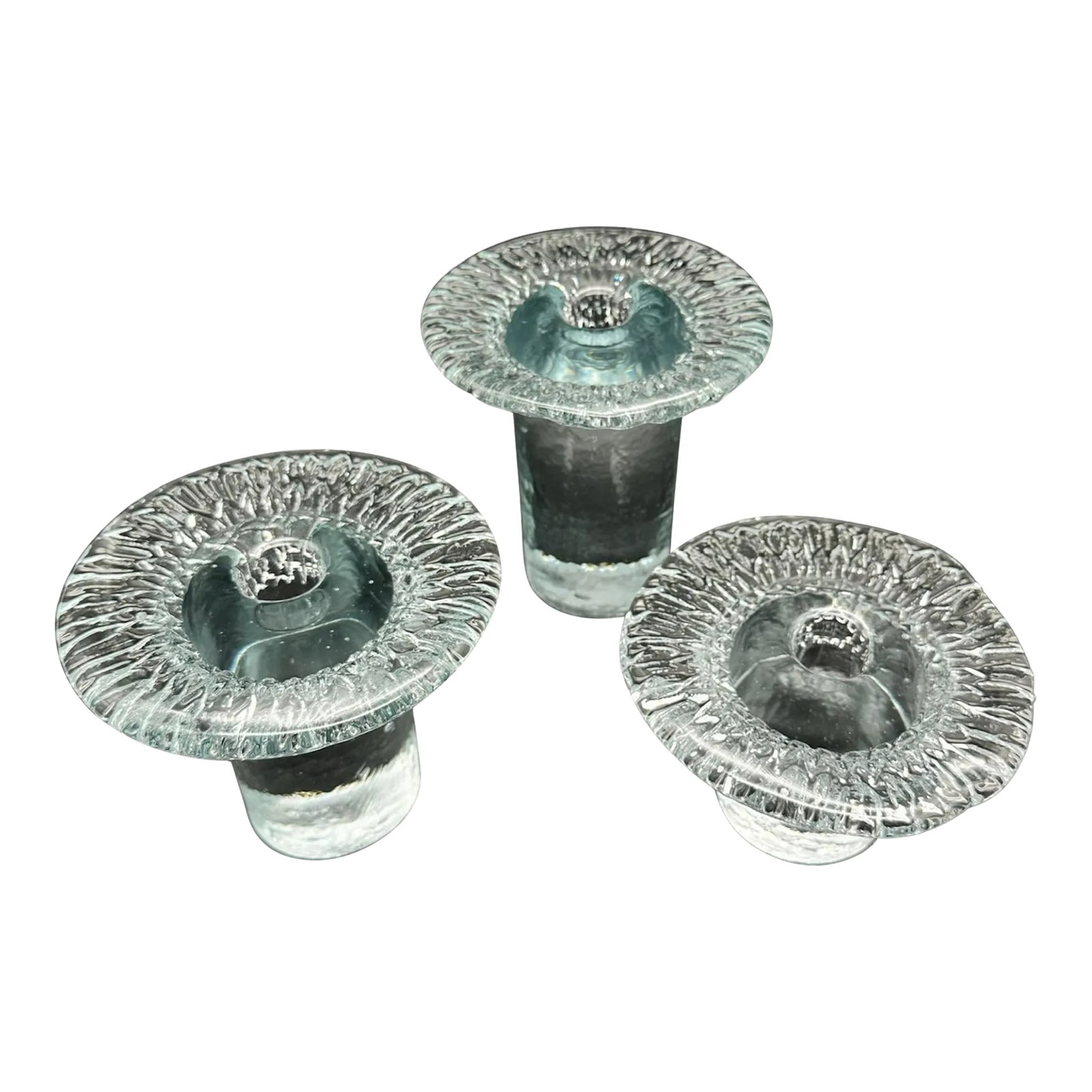Vintage 1977 Blenko Mushroom Crystal Taper Candlestick Holders Set of 3: Stunning set of solid crystal candleholders mushroom-shaped. The quality and the beauty they possess are remarkable. The candle holders are unmarked and they can be found in the 1977 Blenko catalog.