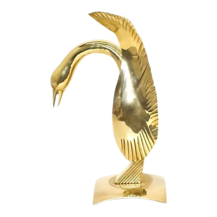 Large Dolbi Cashier Brass Swan: Hollywood Regency style solid brass swan on a concave base. Dimensions: 18" H x 12" D x 7.5" W. Condition: Alterations: Original Condition Unaltered Imperfections: Some Imperfections Condition Notes:
