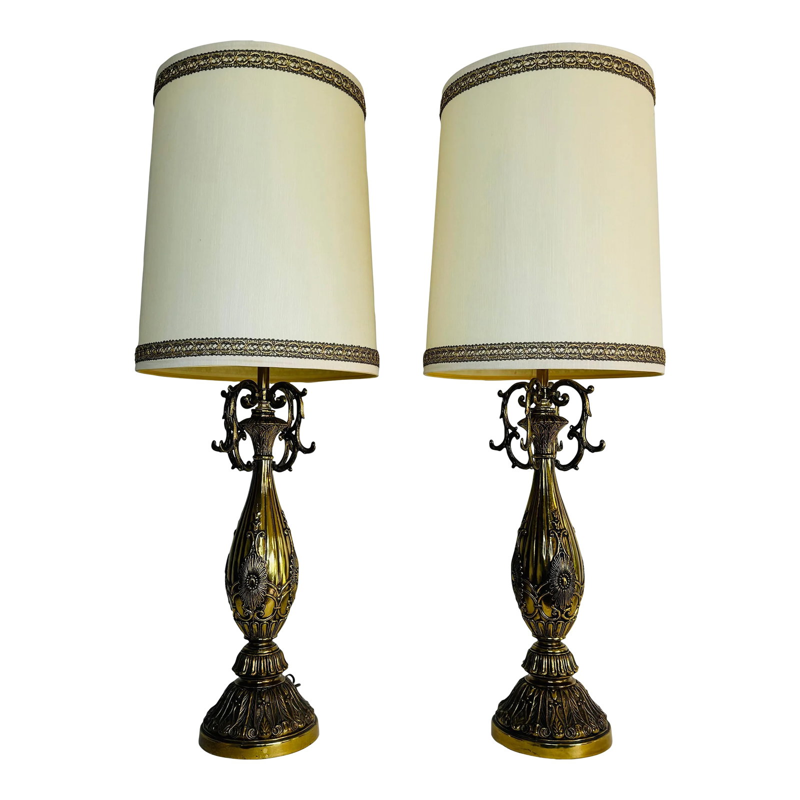 Vintage 1960s Floral Brass Table Lamps With Shades, a Pair: Vintage 1960s pair of solid brass floral table lamps with the original barrel shades. The bases are solid heavy brass with an all over floral design. The shades are original and have a gold lace trim.