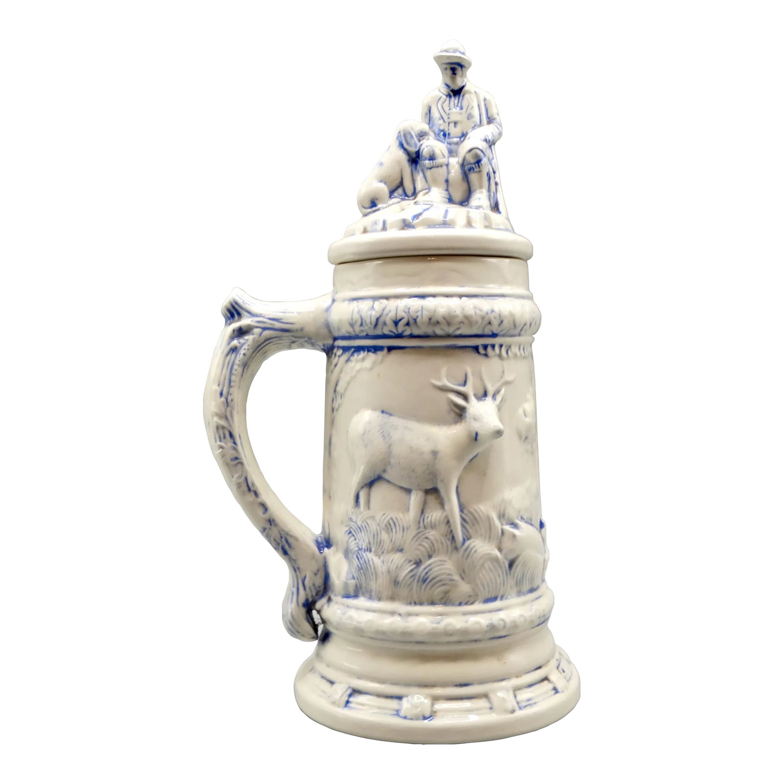 Statement Size German Lidded Stein W/ Hunting Motif Man Dog Stag: Large statement size lidded drinking stein depicting a hunter, dog, and a stag with lovely detail. It is 13 inches in height and handcrafted with a lovely light blue glaze applied over a white body. A