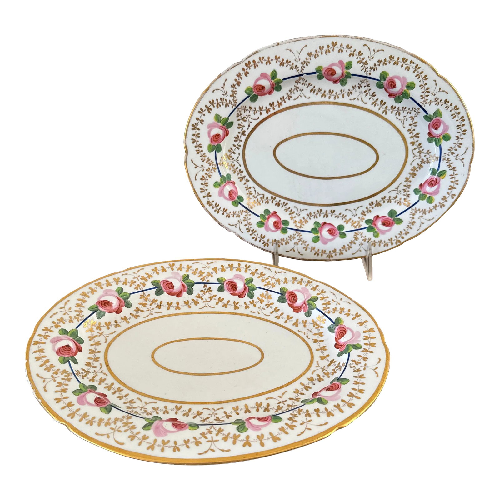 Early 19th Century Coalport Pink Rose Porcelain Platters- a Pair: Listing is for a pair of early Coalport porcelain platter. The oval platters are decorated with pink roses adjoined by a French blue line surrounded by gilded flowers. Only mark is an impressed "1"