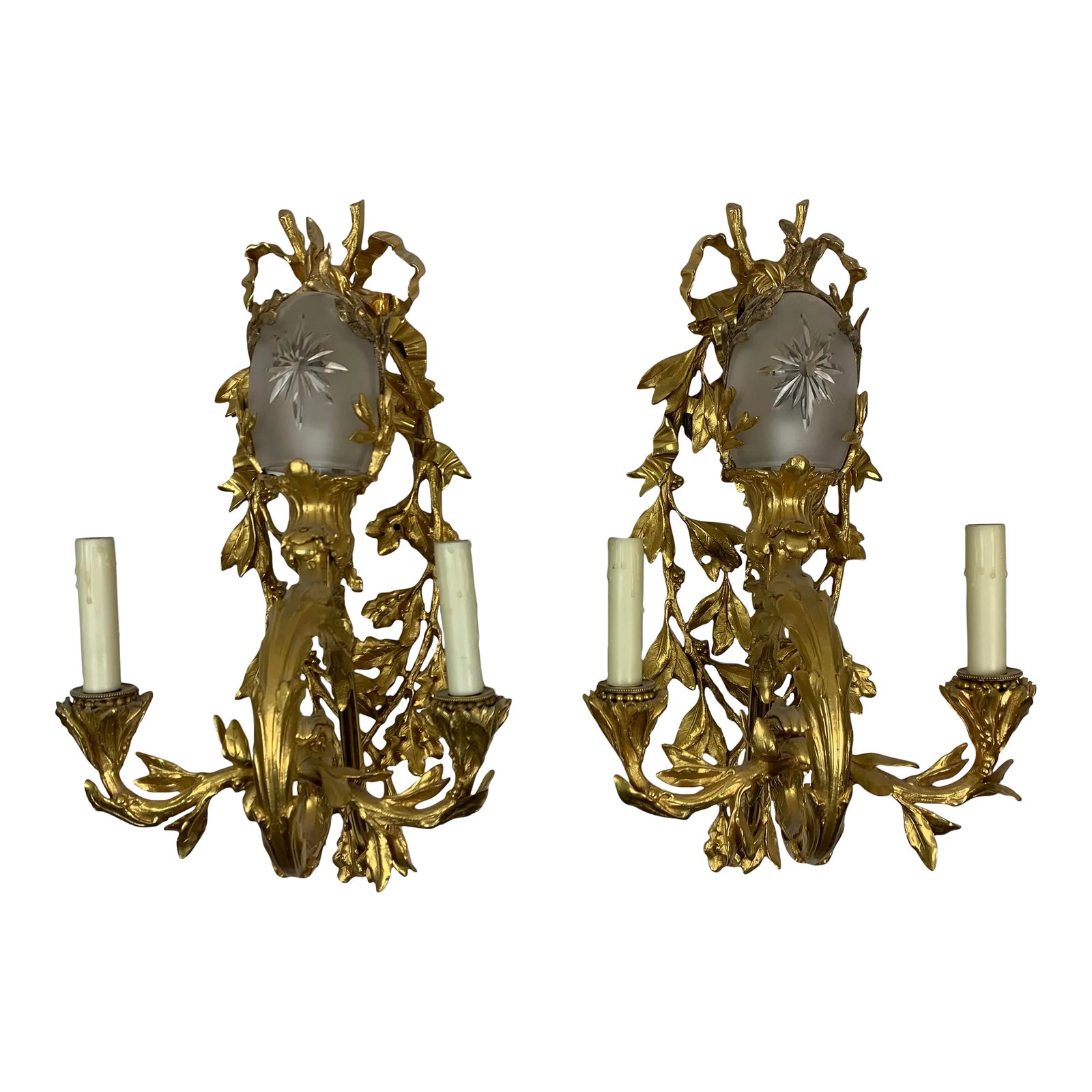 Early 20th Century French Regency Style Gilt-Bronze Sconce With Etched Crystal Shade, Set of 2: Early 20th Century French Regency style Gilt-Bronze 2-candle wall sconce.. Elaborate leaf and bow brass detail and etched crystal egg shapes shade. Set of 2 Condition: Alterations: Original Condition 