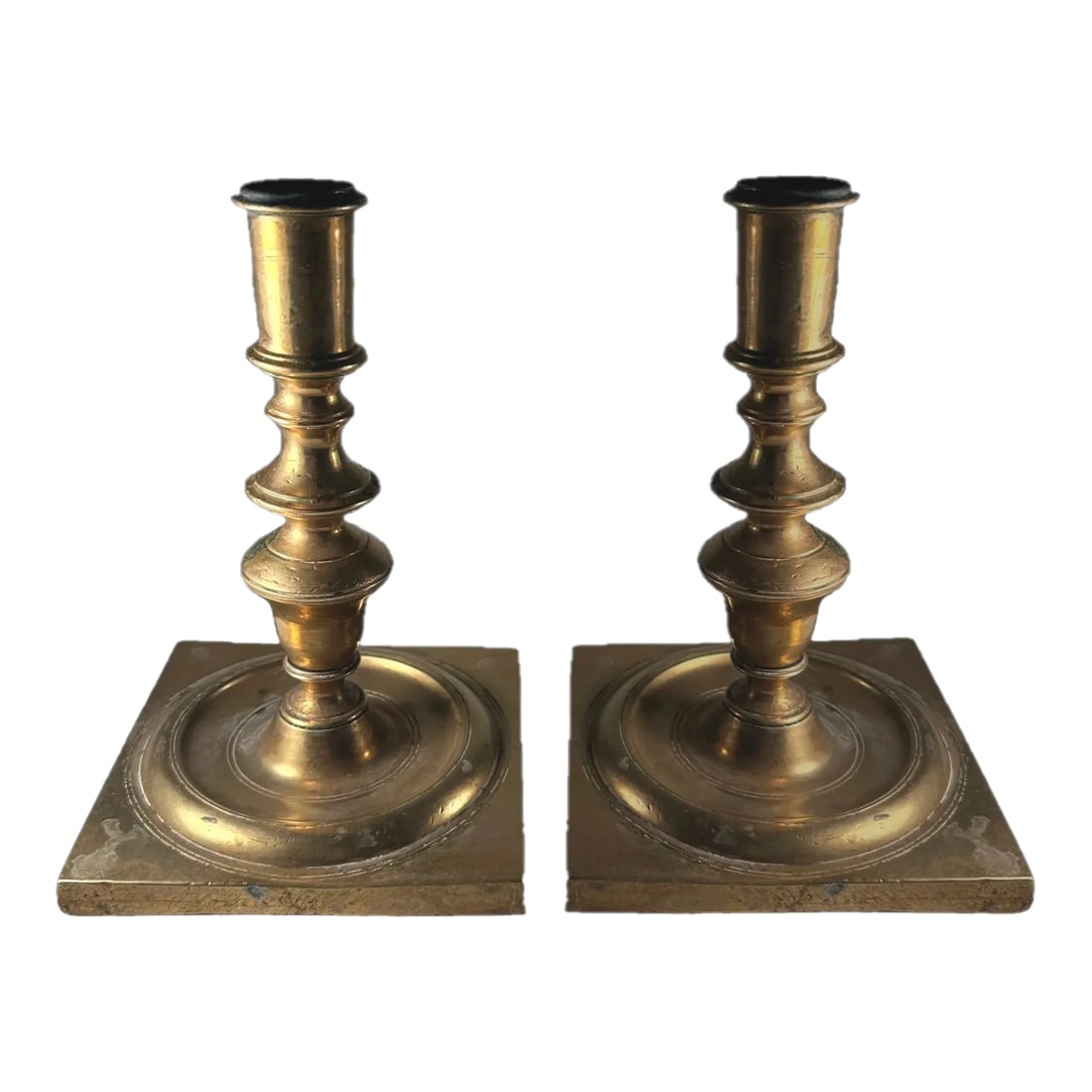Antique 17th Century Pair of Dutch Bronze Candlesticks.: Antique 17th Century Pair of Dutch Bronze Candlesticks. Very rare pair of Dutch Baroque heavy bronze cast candlesticks with a four sided base, circa 1680. The very large square base is created with a