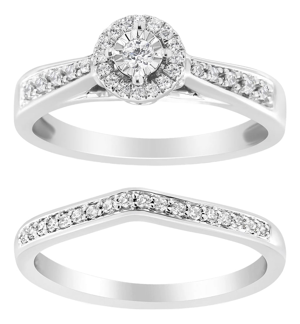 .925 Sterling Silver 1/3 Cttw Diamond Halo and Pave Shank Engagement Ring Set (I-J Color, I3 Clarity: Immerse yourself in the timeless elegance of this rhodium-plated .925 sterling silver engagement ring set, where classic craftsmanship meets contemporary design. Each piece gleams with natural