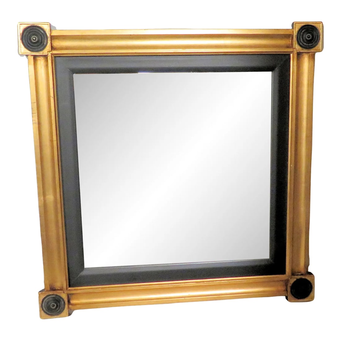 Vintage Empire Revival Gilt Wood Wall Mirror: This Gilt wood Empire style mirror has Napoleonic medallions in the four corners of the wooden frame. It's a perfect size for any room in the house, and it's simple but elegant design will create a st
