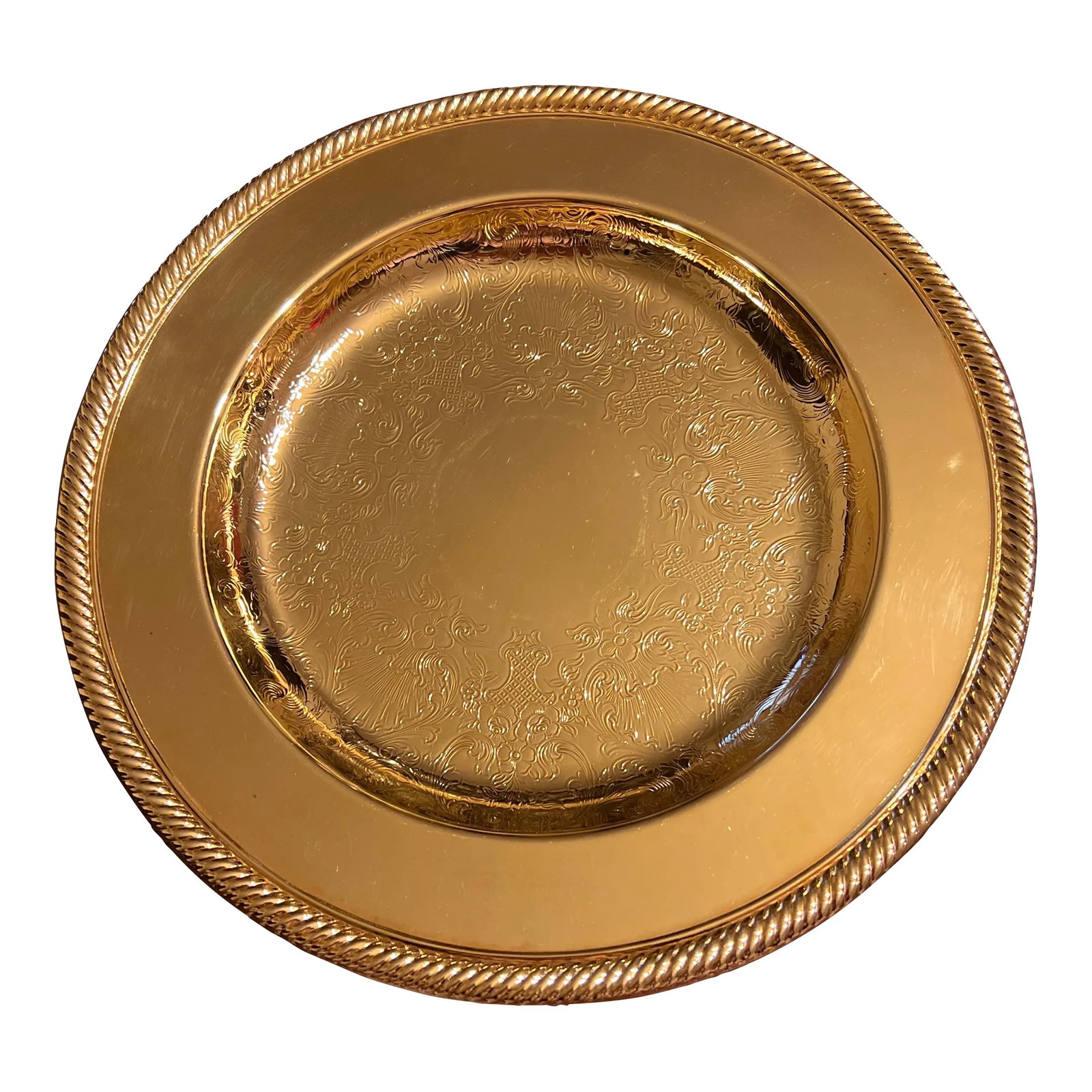 1980s 24 Karat Gold Plated Serving Service Tray Charger: Beautifully designed with elaborate detail, a vintage 24 karat gold plated tray features: - flat rim with ridged design - measures 10 1/8" diameter; .75" height - pre-owned condition; some surface