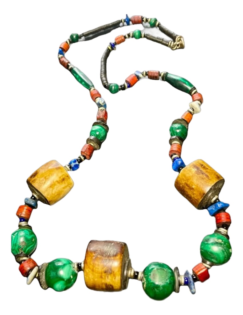 Early 20th Century Antique Tibetan Malachite, Water Buffalo's Horn With Lapis & Shell Necklace: Incredible necklace large round barrels of horn (yak or water buffalo) rounds beads of malachite heishi shell beads and painted red wooden beads, accompanied by chunks of lapis gemstones. A very power