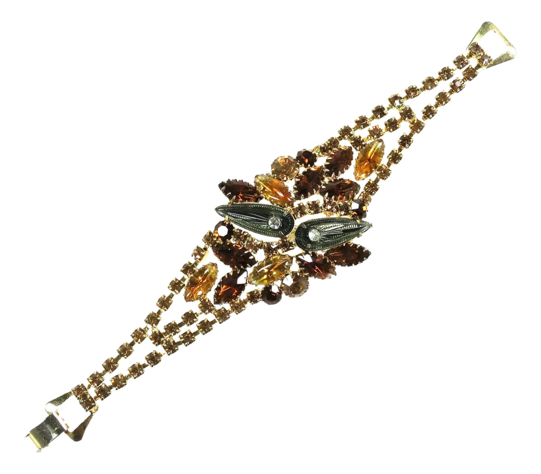 Vintage Citrine Crystal Art Glass Bracelet 1950s: Vintage 1950s gold-plated crystal and art glass bracelet. Domed centerpiece w/ citrine and amber crystals surrounding elongated teardrops of carved olivine art glass set w/ clear crystals, flanked by