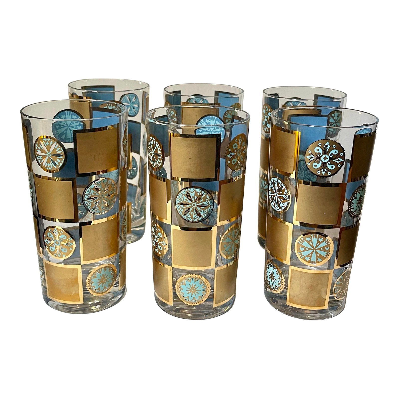 1960s Culver "Carnival" Turquoise & Gold Tumblers - Set of 6: A classic mid 20th century set of tumbler glasses patterned with stylized turquoise and gold medallions interspersed with matte gold shine edged squares. Made by Culver Ltd. of Brooklyn, New York.