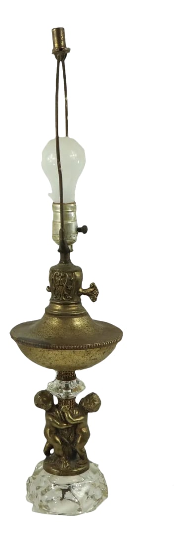 Vintage Hollywood Regency Vintage Brass Cherub Crystal Table Lamp: Vintage Brass Crystal Cherub Hollywood Regency Lamp Table Lamp Has patina on the brass and the cherubs. No lampshade Does not come with a light bulb. Tested and works Measurements: 25 inches from top 