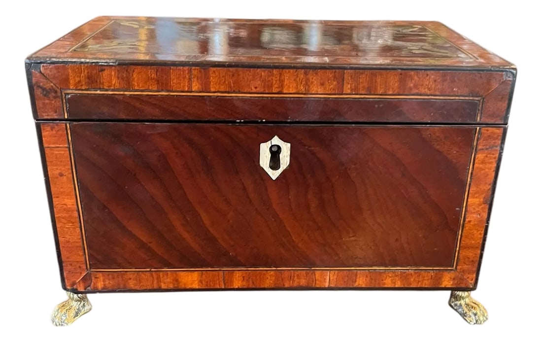 19th Century Regency Style Tea Box With Key: A refined 19th century English tea box in the elegant regency style, complete with its original key. Crafted with clean lines and understated brass accents, this box captures the balance and symmetry