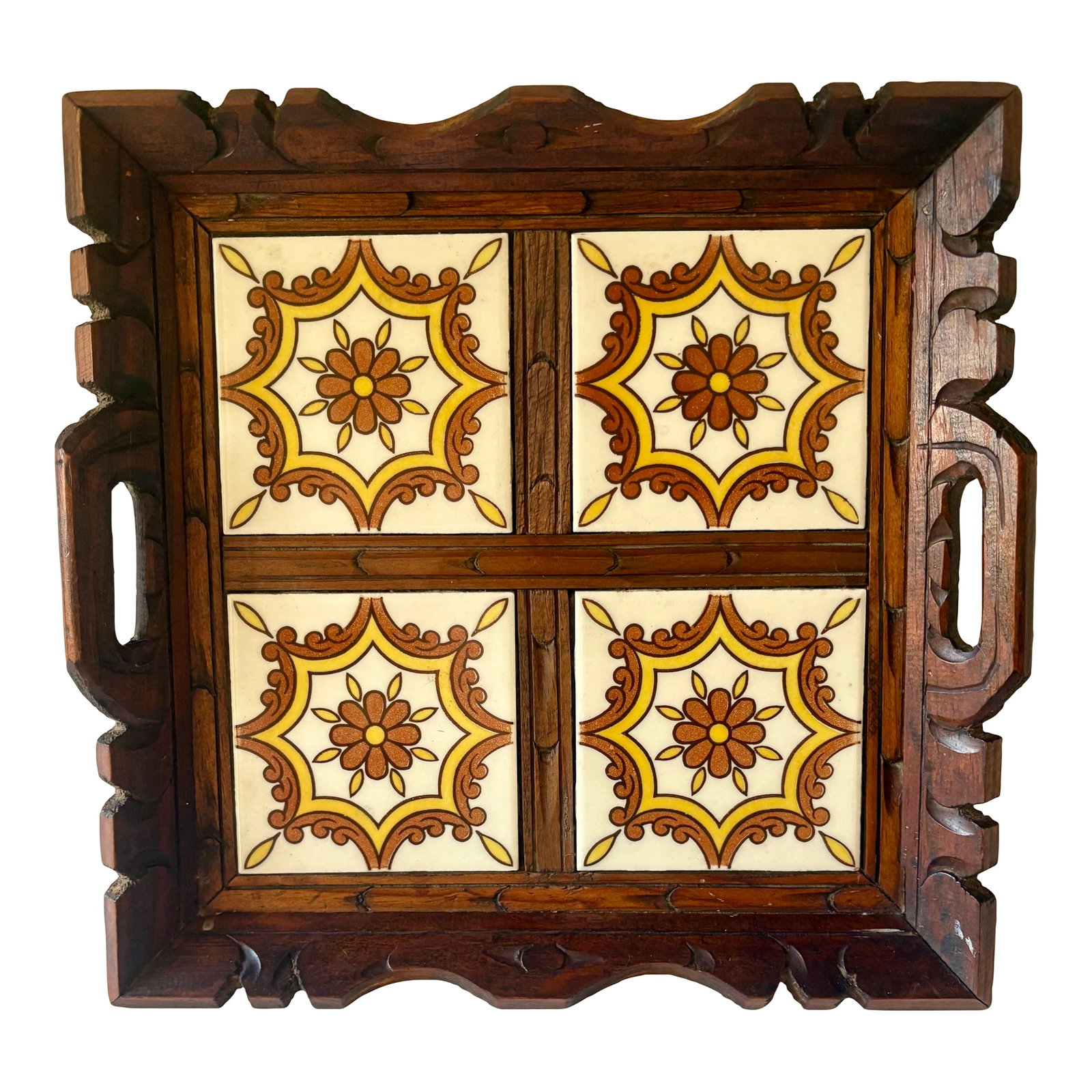 Vintage Mexican Carved Wood and Floral Tile Tray: This Mexican folk art tray features a frame of carved wood with four square ceramic tiles that feature traditional Mexican floral artwork in yellow, brown and white. The square tiles measure 4.25" x4.