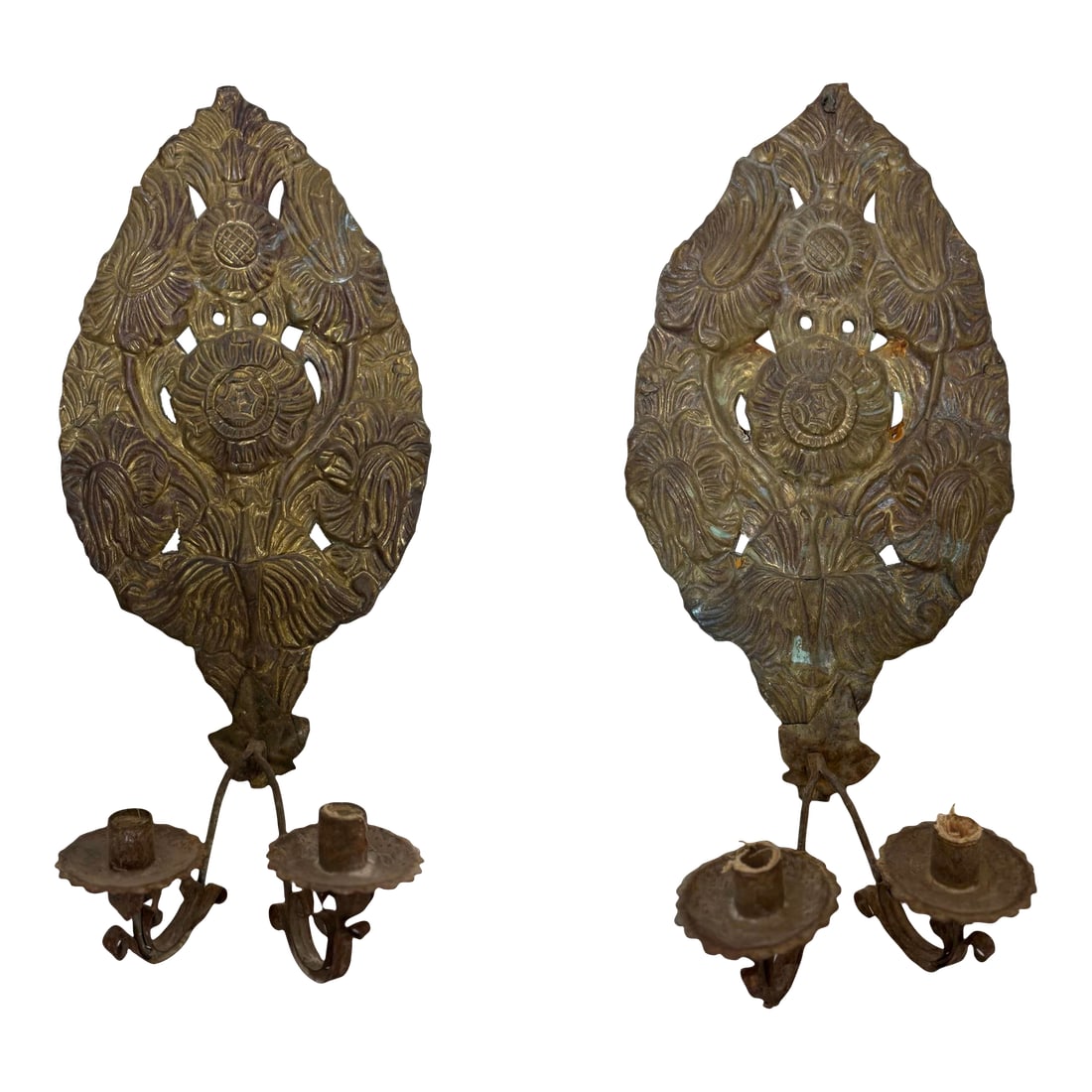 Pair of 18th Century Dutch Sconces Depicting Sunflowers: A charming pair of 18th century Dutch hammered metal sconces, each beautifully crafted with a stylized depiction of sunflowers. Rich in texture and patina, these rare wall sconces reflect the artistry