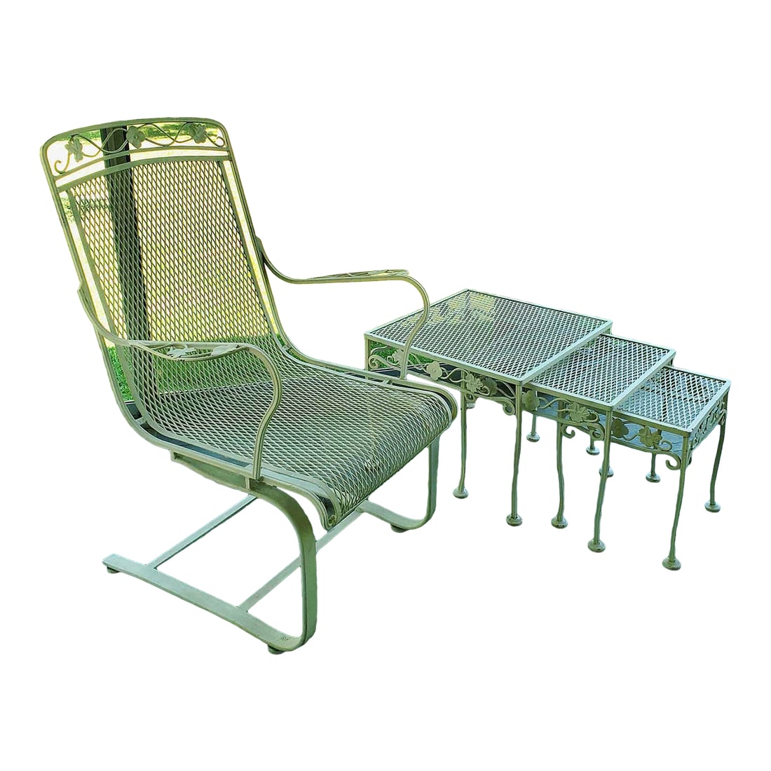 Vintage Meadowcraft Wrought Iron Lounge Chair and Nesting Tables: Meadowcraft Wrought Iron Metal and Mesh Cantilevered Lounge Chair, from the Dogwood pattern series. Circa late 1960's/1970. Please note pieces have a few places where paint has chipped off, free of ru