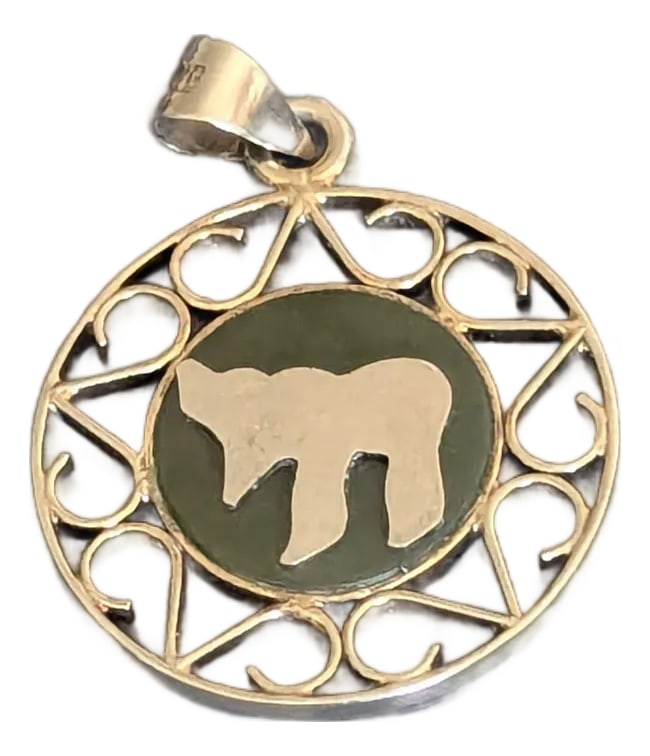 Vintage Chai Pendant, Silver and Jade: Medium, small, a classy silver Chai inserted in Jade with a surrounded by stylized filigree. Condition: Alterations: Original Condition Unaltered Imperfections: Some Imperfections Condition Notes: Ver