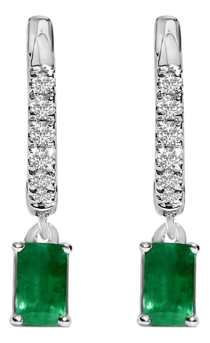 10K White Gold Oval Green Emerald and 1/8 Cttw Diamond Drop Earrings, A Pair: These exquisite earrings crafted from rhodium-plated 10K white gold embody classic elegance with a modern twist. Each piece starts with a shimmering trail of natural diamonds, totaling 1/8 carats, met