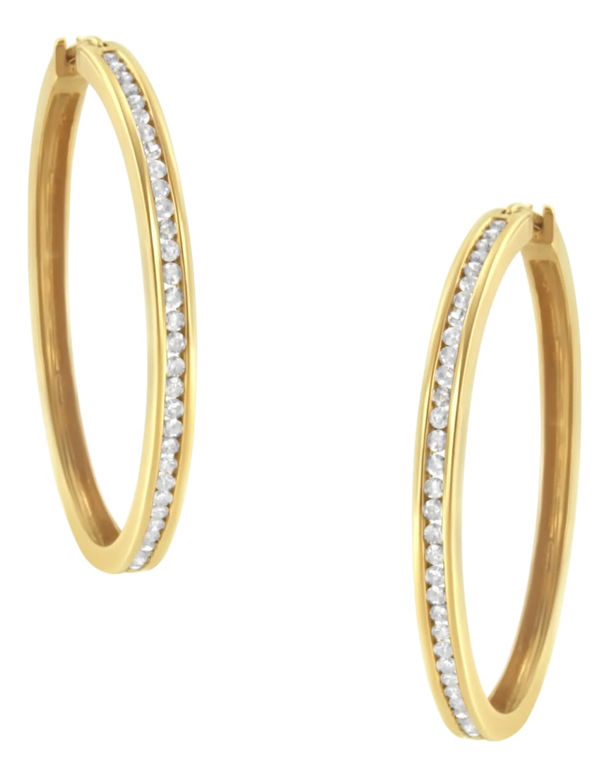 10KT Yellow Gold 1 cttw Slim Diamond Hoop Earrings (I-J Color, I1-I2 Clarity): You can't go wrong with these classic 1ct TDW diamond hoop earrings. Sixty six channel set, round cut diamonds sparkle against the warm tone of this 10k yellow gold design. A clip on mechanism keeps