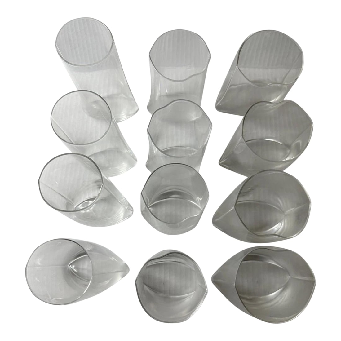 Crinkle Futuro Glass by Designer Makoto Komatsu Set of 12 - Extremely Rare 1979: Very Rare Set by Designer Makoto Komatsu Condition: Imperfections: No Imperfections Condition Notes: Very Rare and Featured on MoMA Origin: United States Materials & Techniques: Glass Details: