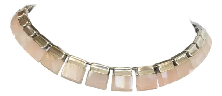 1990s Taxco Sterling and Rose Quartz Necklace: Incredible craftsmanship in this sterling and rose quartz necklace. It consists of rectangular pieces of rose quartz mounted on the sterling plates that make up the necklace. Secure push closure