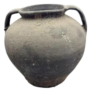Vintage Moldovan Terracotta Vessel: A vintage terracotta vessel from Moldova is a handmade clay pot with a simple, rustic charm. These vessels can have two handles, a single handle, or no handles at all, depending on how they were meant