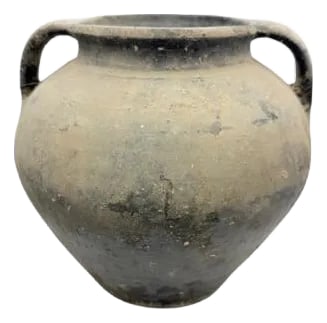 Vintage Moldovan Terracotta Vessel: A vintage terracotta vessel from Moldova is a handmade clay pot with a simple, rustic charm. These vessels can have two handles, a single handle, or no handles at all, depending on how they were meant