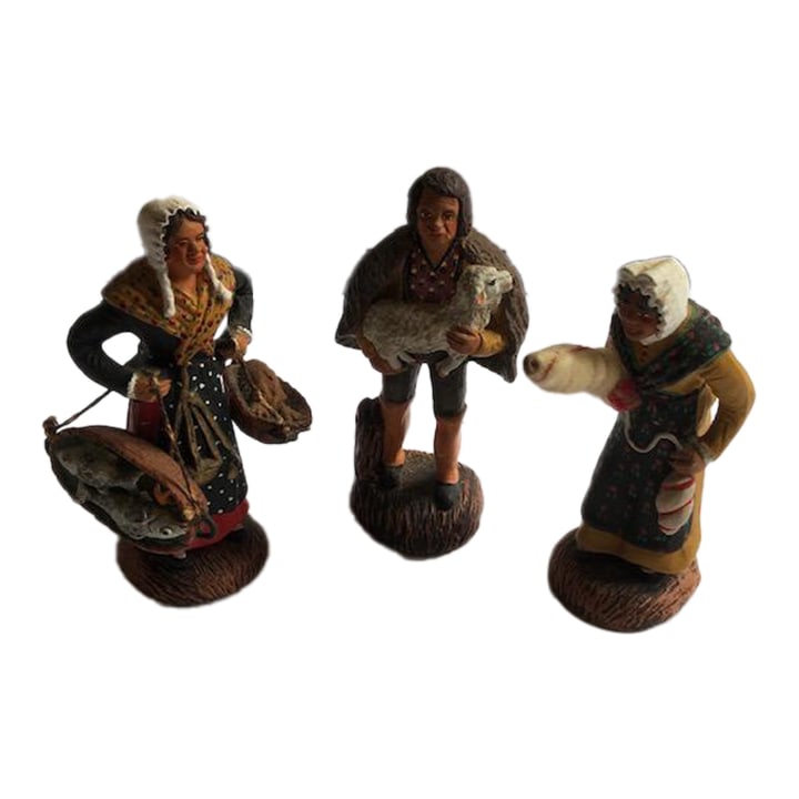 Mid 20th Century Swedish Terracotta Folk Figurines, Set of 3: A sweet set of three vintage mid-century figurines, depicting folk life in Sweden. One each of shepherd, fishmonger, and seamstress. Made of terracotta and hand-painted. Condition: Alterations: