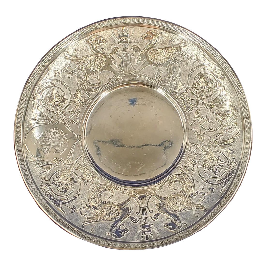 Mid 19th Century Tiffany & Co Sterling Griffin Dragon Plate Demitasse Saucer 1863: This Tiffany & Co 7" sterling silver saucer / plate has intricate engravings with 2 pairs of griffins or dragons opposite of each other on the outer rim. These are slightly different mythical