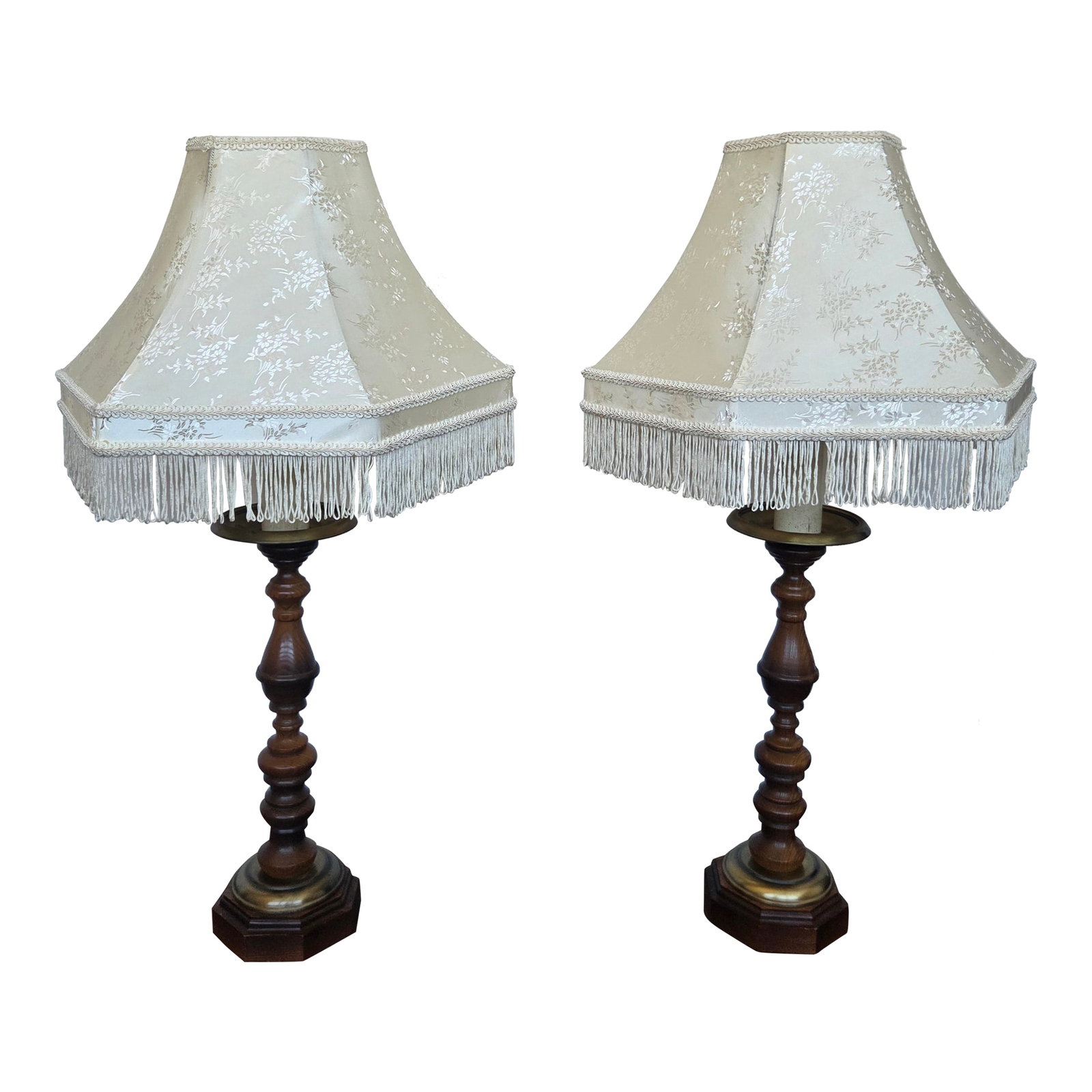 Mid 20th Century Traditional Colonial Revival Turned Wood & Brass Table Lamp W/ Fringe Shade - a Pai: This matching pair of vintage table lamps showcases classic turned wood craftsmanship paired with warm brass accents and traditional bell-shaped fabric shades trimmed in fringe. The tall, stately silh